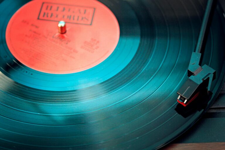 A detailed close-up view of a vintage vinyl record spinning on a turntable, capturing its nostalgic beauty.