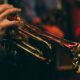 person playing trumpet during night time