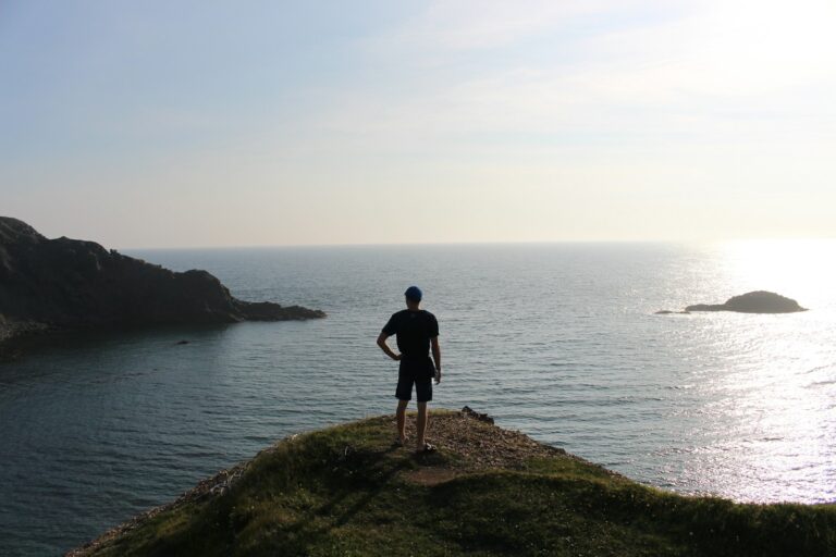 man standing near the ocean