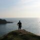 man standing near the ocean